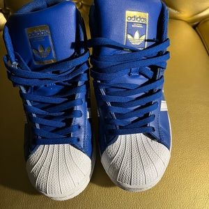 Royal blue high top adidas sneakers